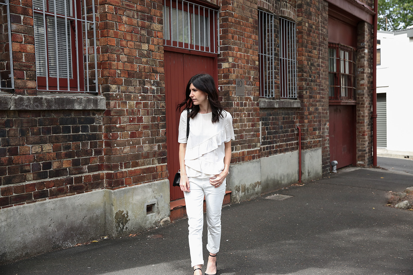 Wearing boyfriend jeans with a frill tee - Mademoiselle