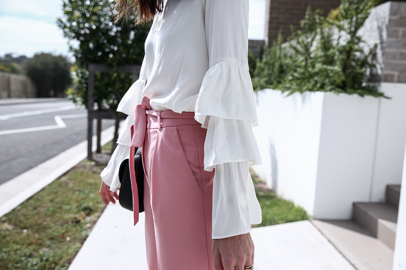 Outfit wearing pink trousers and a ruffle sleeve top  Mademoiselle   Minimal Style Blog