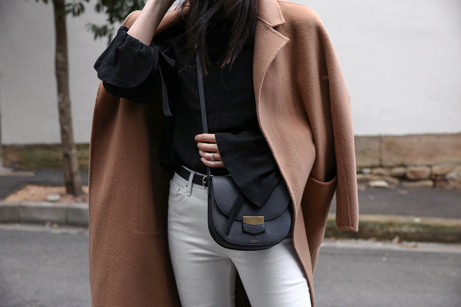 Jamie Lee of Mademoiselle wearing a Scandi style outfit and a Celine trotteur bag