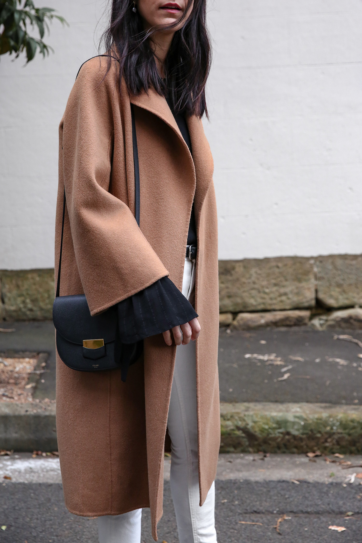 Jamie Lee of Mademoiselle wearing a Scandi style outfit and a The Curated camel wrap coat