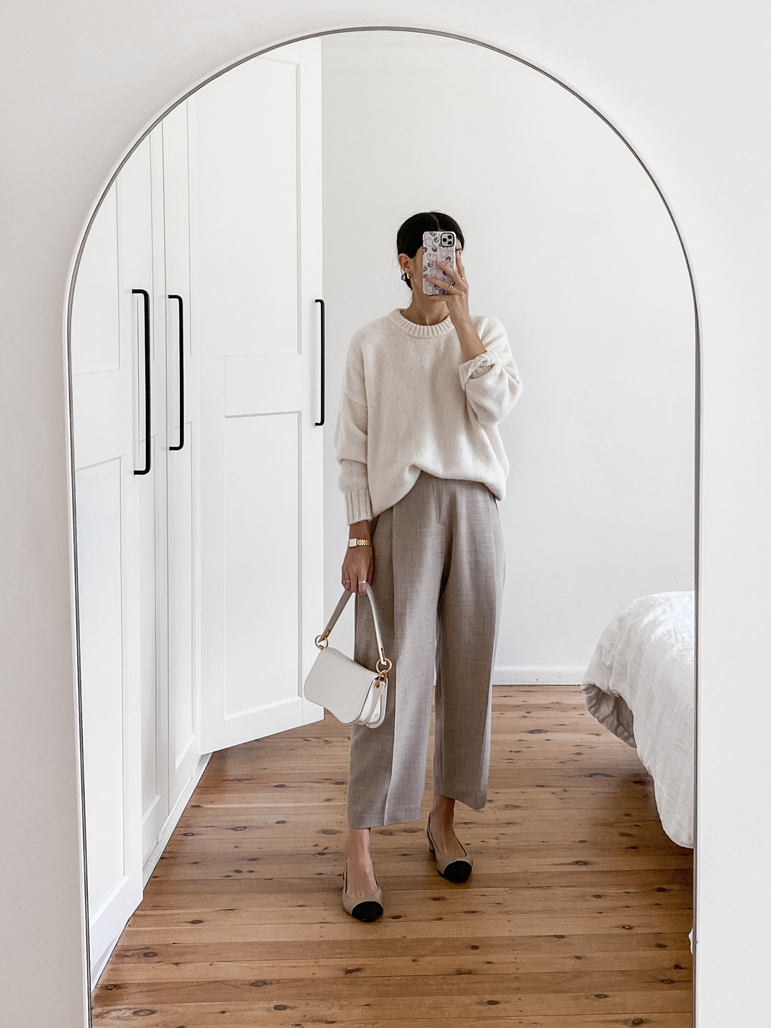 Minimal neutral outfit wearing Jenni Kayne alpaca knit and Facade Pattern trousers