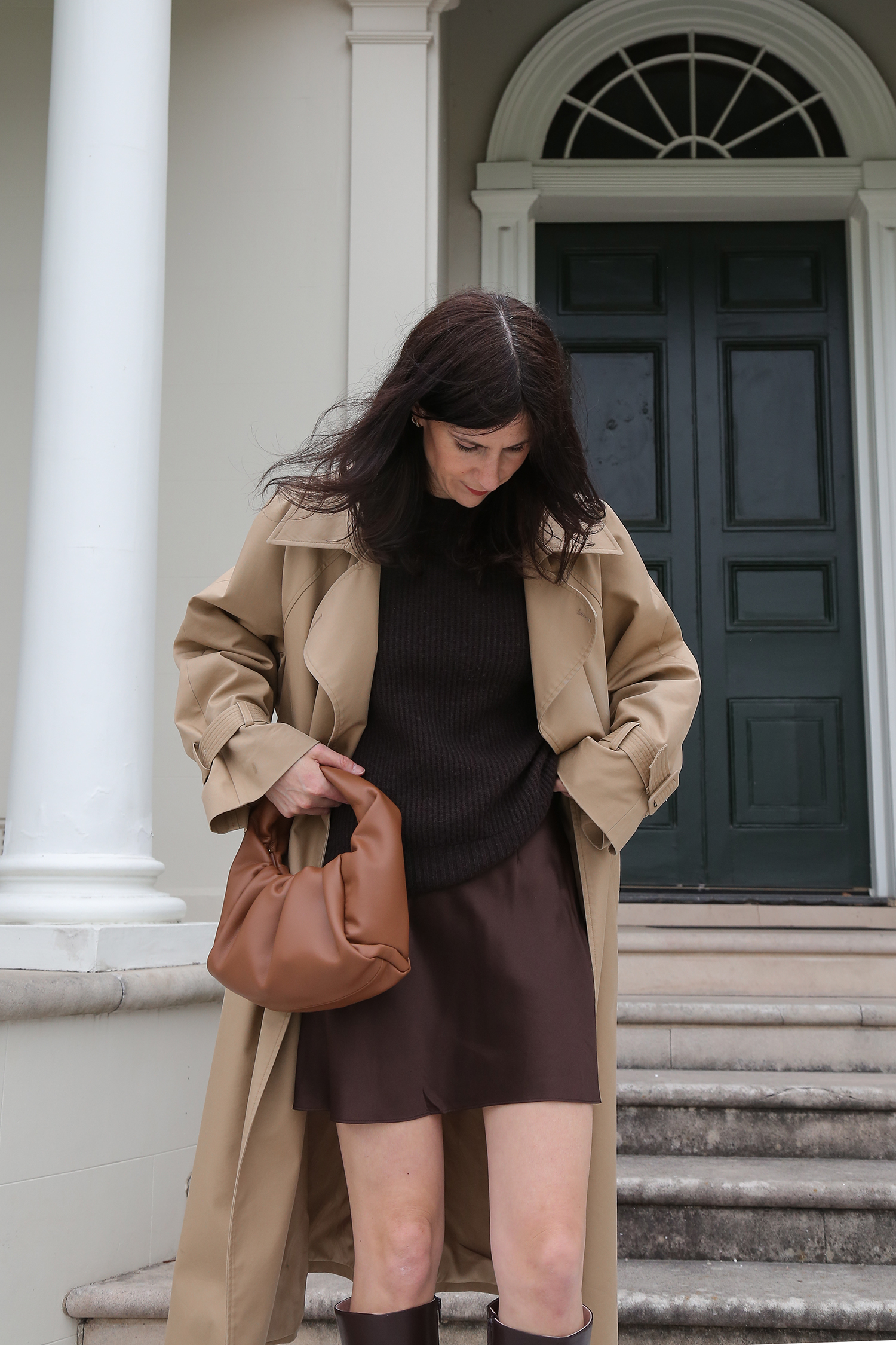 Kindersalmon trench coat worn with Bob Ore bag and Quince silk mini skirt