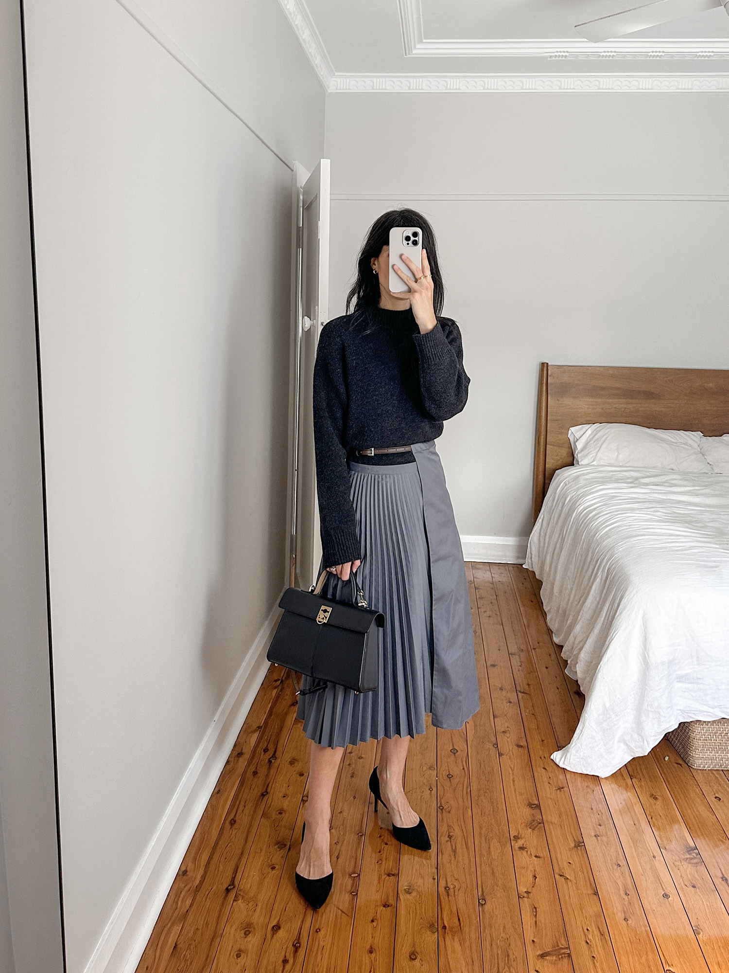 Wearing Jenni Kayne cotton oversized knit with Tibi pleated skirt