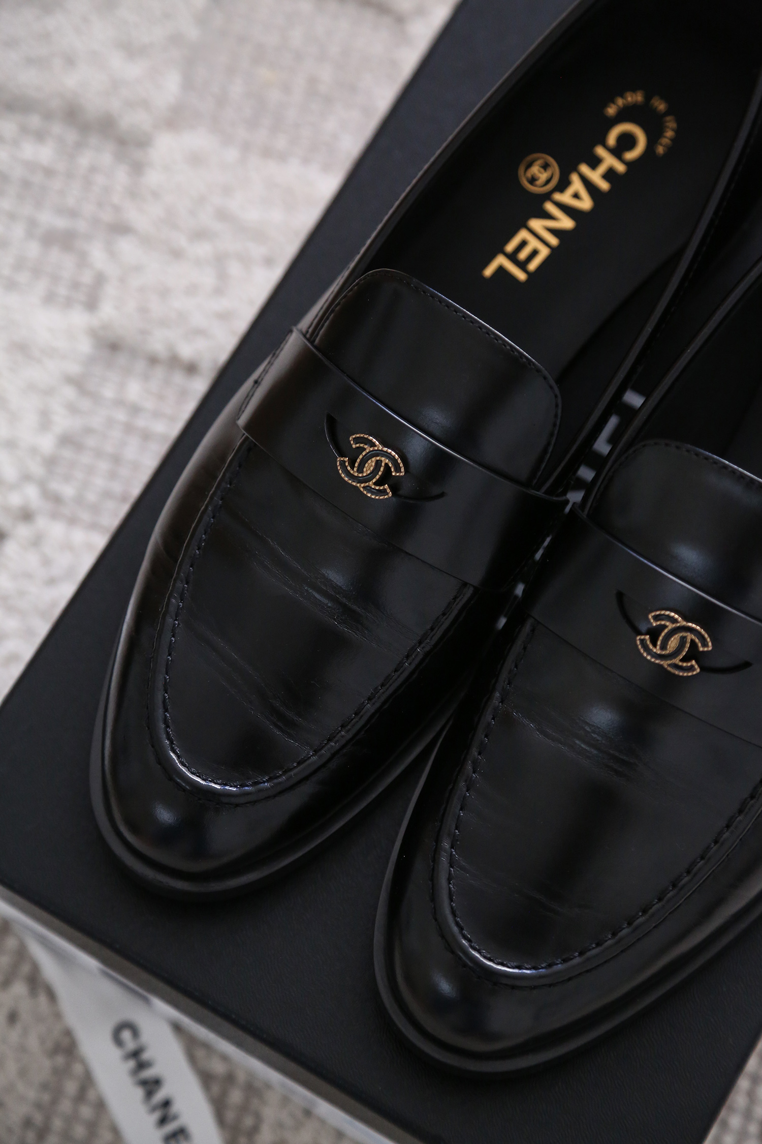 Close up details of Chanel loafers