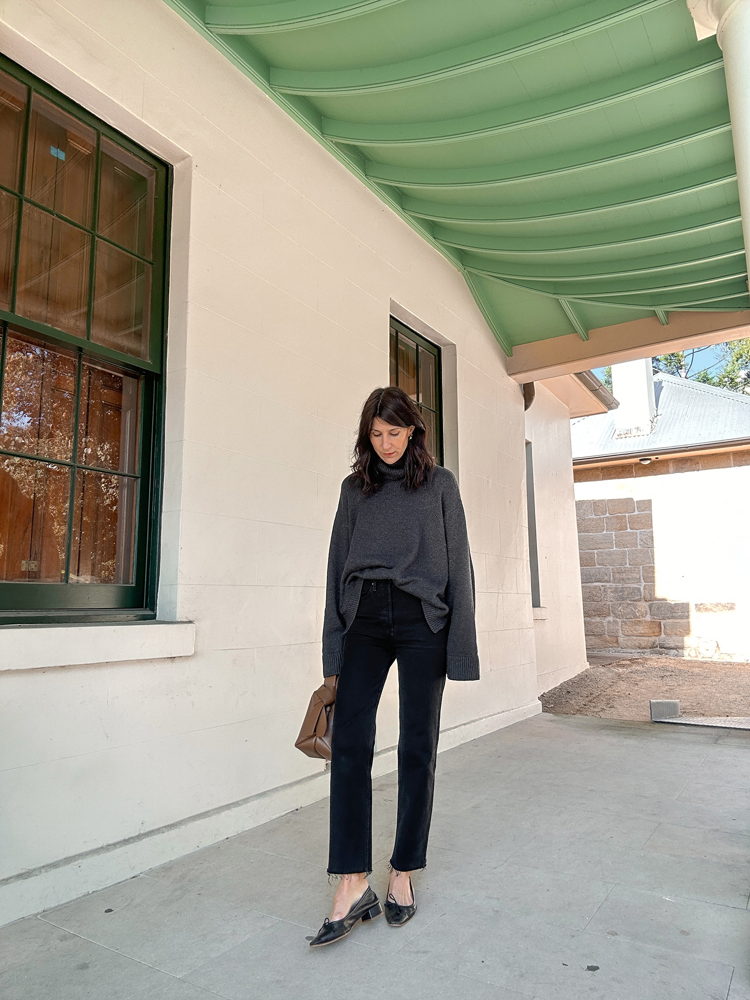 Minimal outfit wearing The Frankie Shop Rhea jumper and Toteme jeans