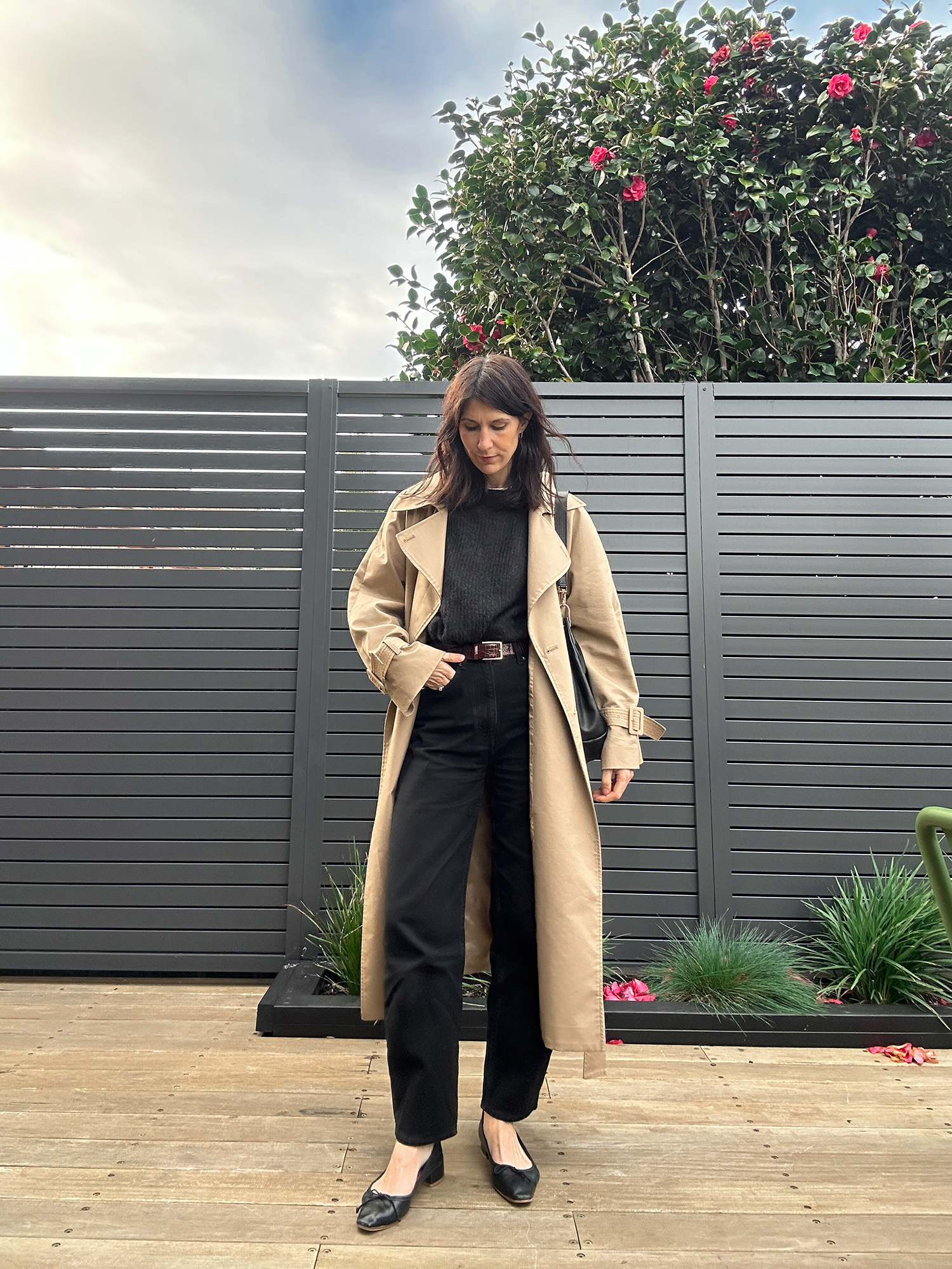 Minimal outfit wearing Kindersalmon trench coat