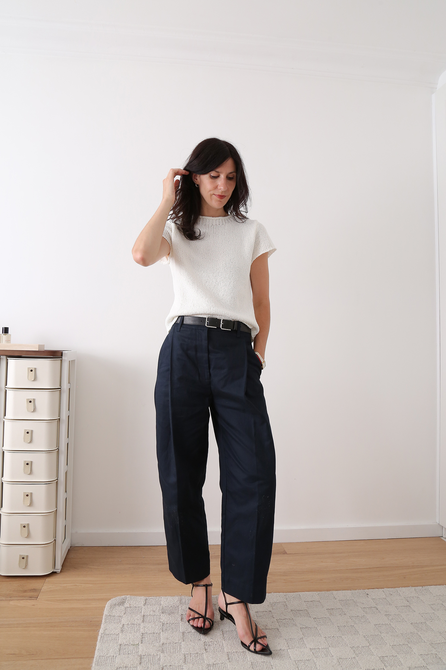 White slim knit tee with navy trousers