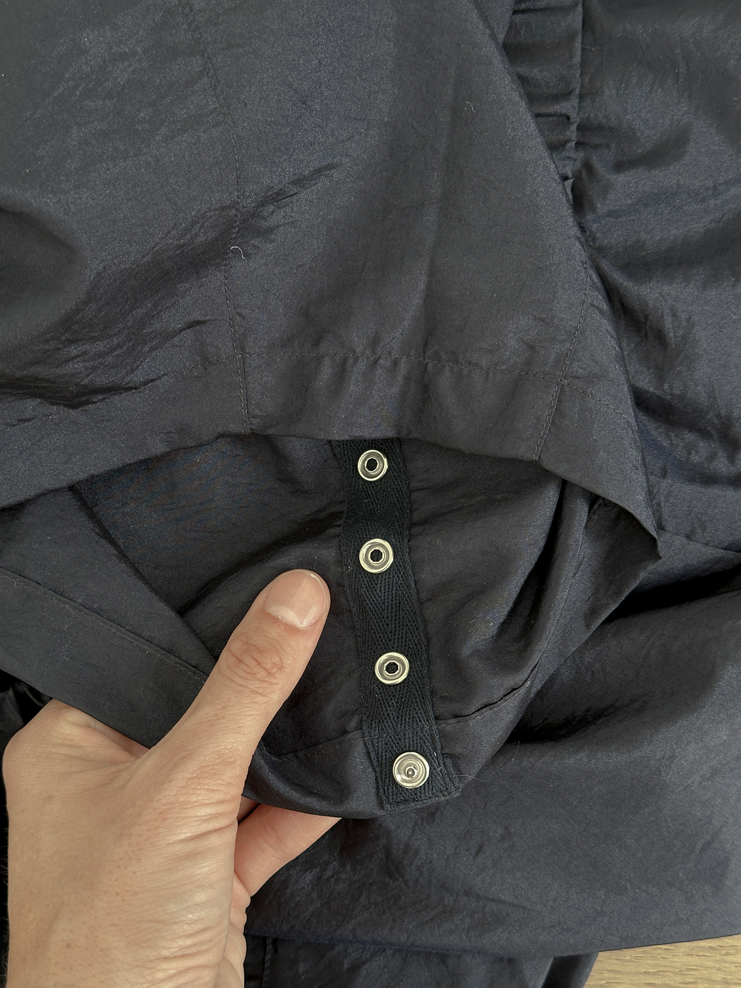 Snaps on hem of trouser to adjust length