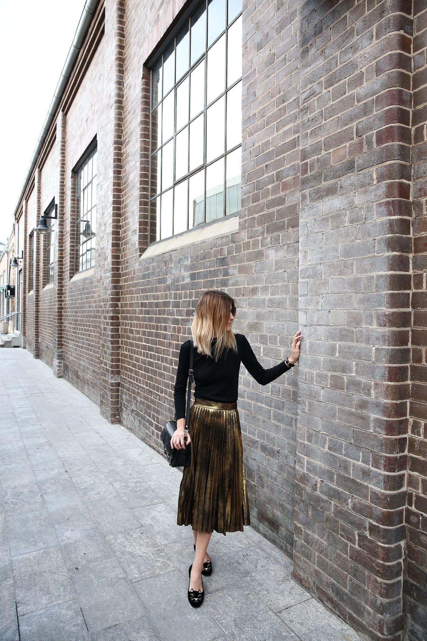 Gold Pleated Midi Skirt and Sneakers